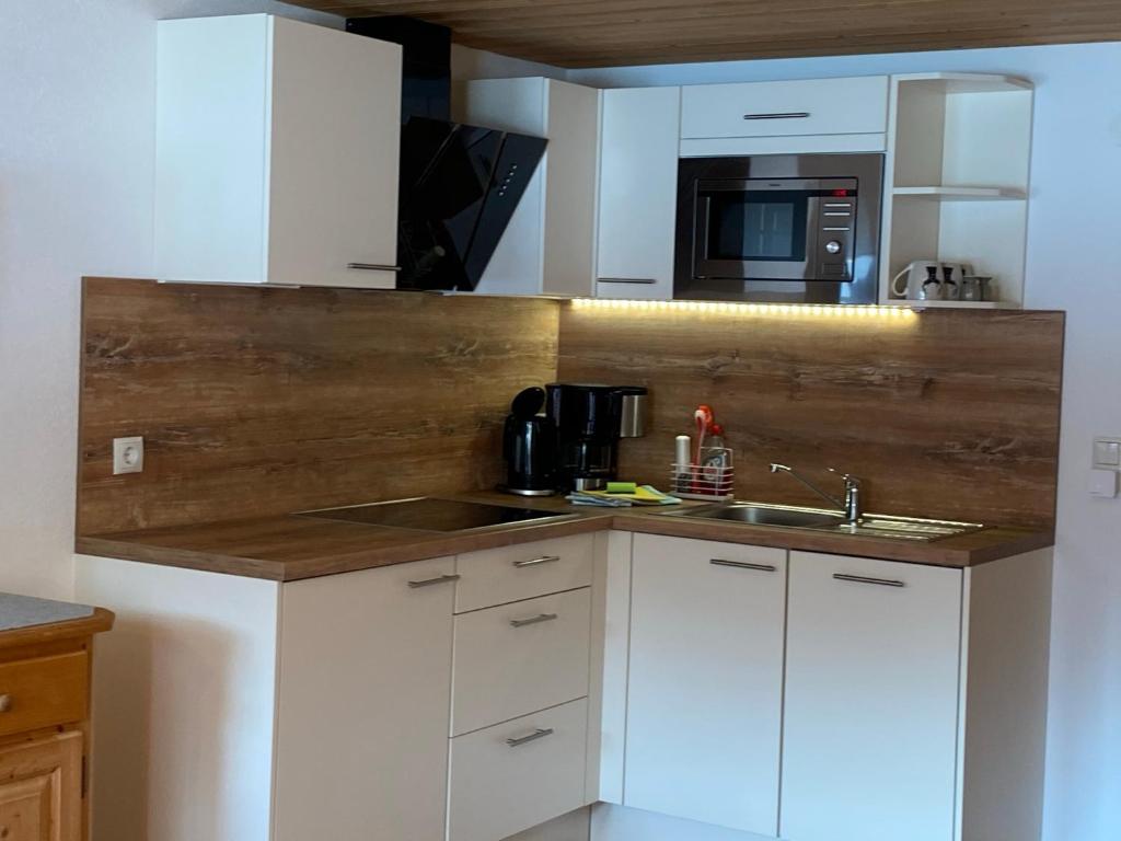 Kuchyň nebo kuchyňský kout v ubytování Gästehaus Nussbaumer