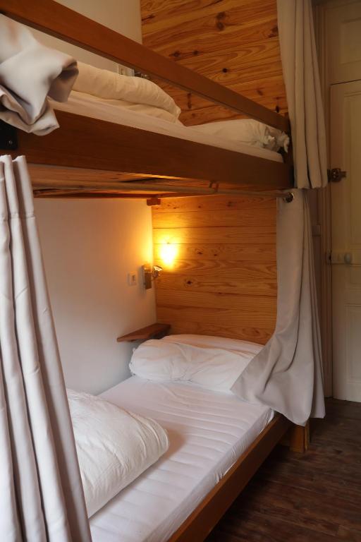 Postel nebo postele na pokoji v ubytování Solfé Backpacker