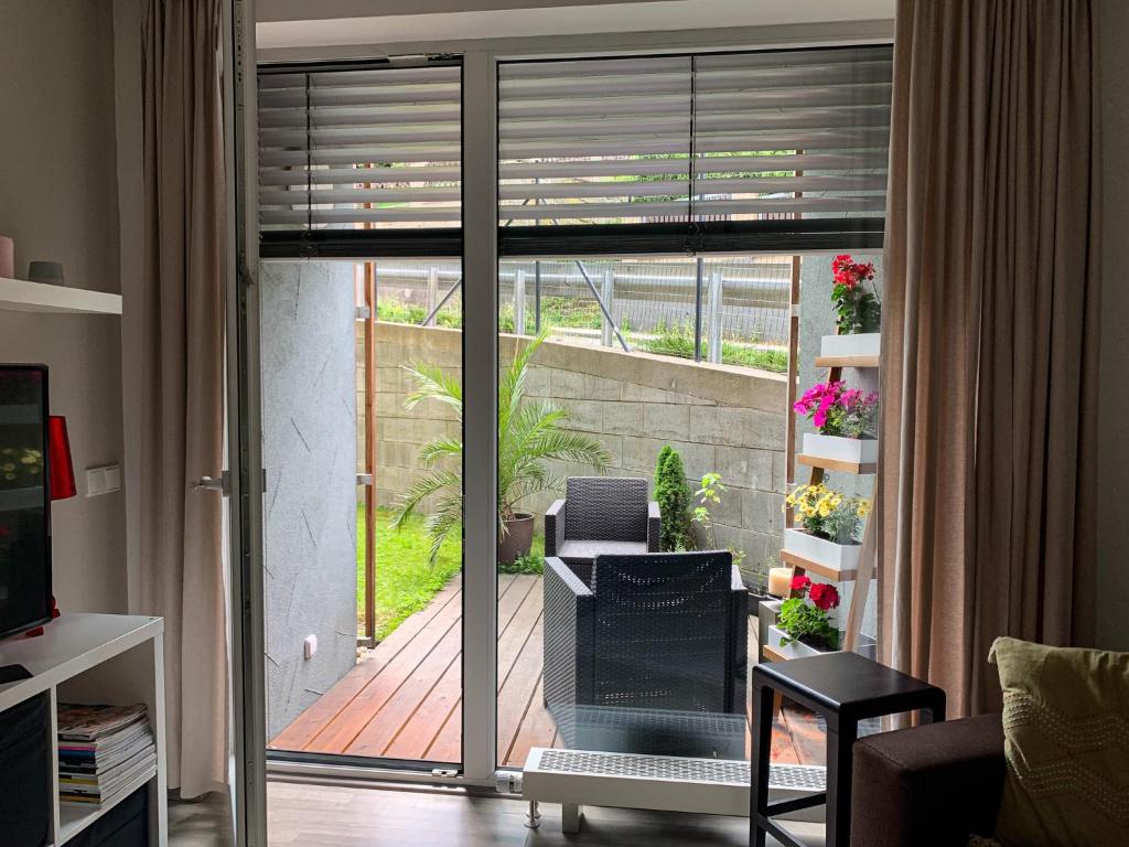 Posezení v ubytování Jezerní apartmán s terasou a saunou v Lakepark Residence