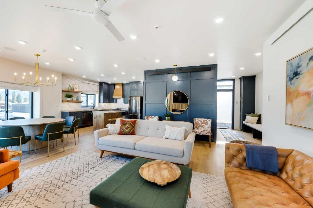 a living room with a couch and a table at The Lofts on 89 Condo in Heart of Downtown Afton! in Afton