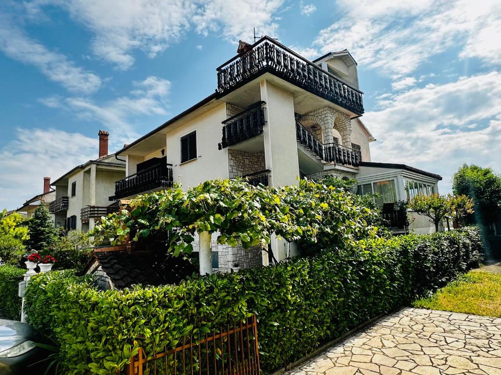 a large white house with a balcony on top of it at CASA BLANCA in Umag