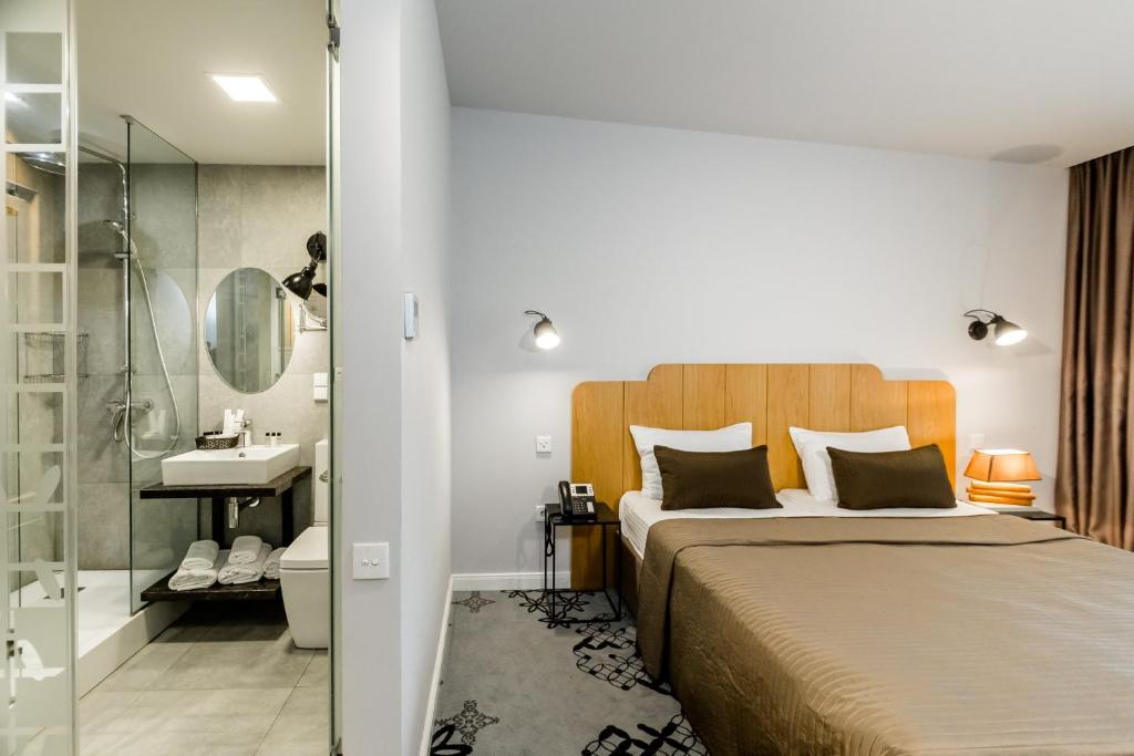 Postel nebo postele na pokoji v ubytování Rasta Maidan Hotel