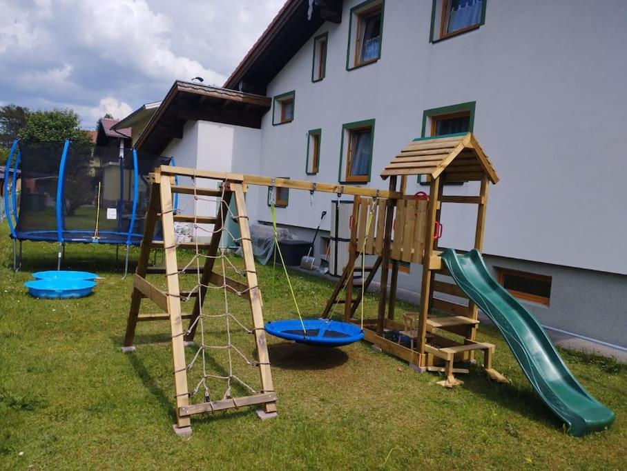 a group of playground equipment in a yard at Ferienwohnung Patrycja in Weissenbach am Lech
