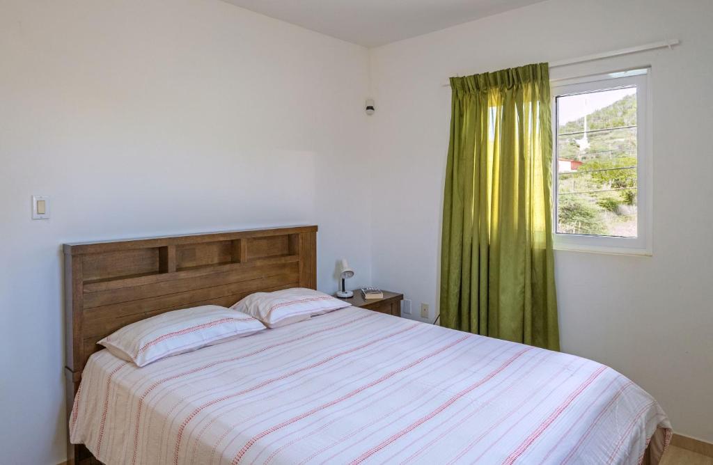 Ein Bett oder Betten in einem Zimmer der Unterkunft Whitehouse Lagun Apartments