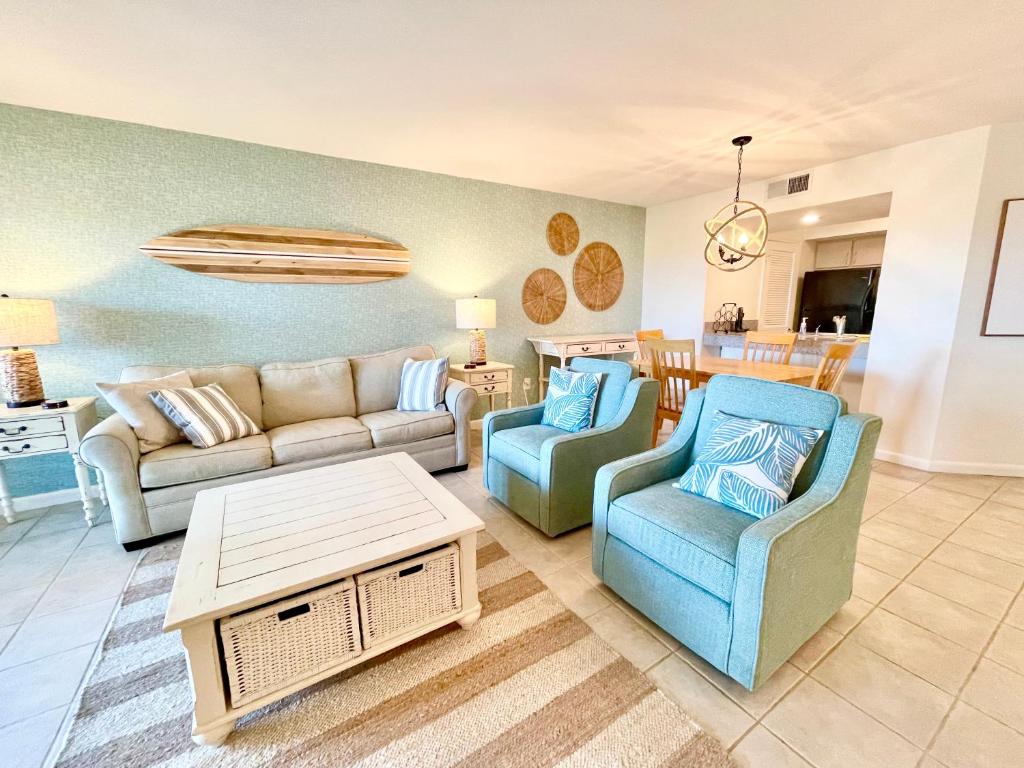 a living room with a couch and chairs and a table at 1391 Pelican Watch Villa in Seabrook Island