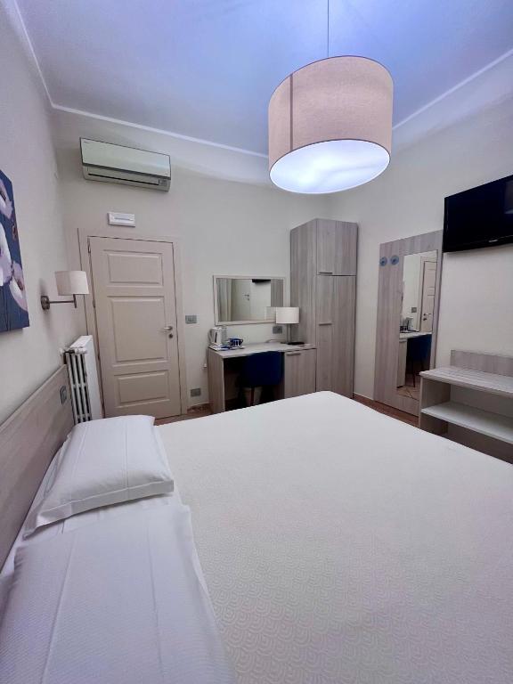 Postel nebo postele na pokoji v ubytování Albergo Africa