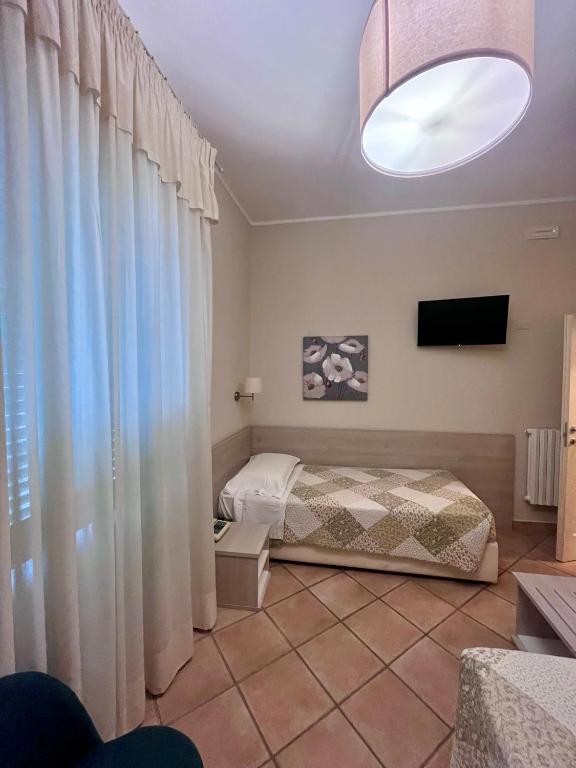 Postel nebo postele na pokoji v ubytování Albergo Africa
