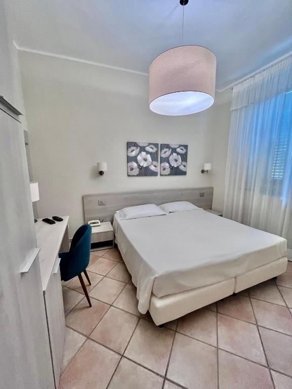 Postel nebo postele na pokoji v ubytování Albergo Africa
