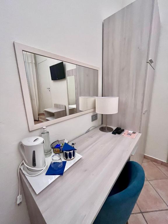 TV a/nebo společenská místnost v ubytování Albergo Africa