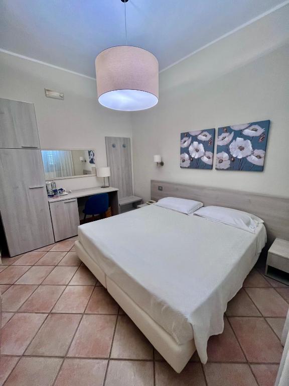 Postel nebo postele na pokoji v ubytování Albergo Africa