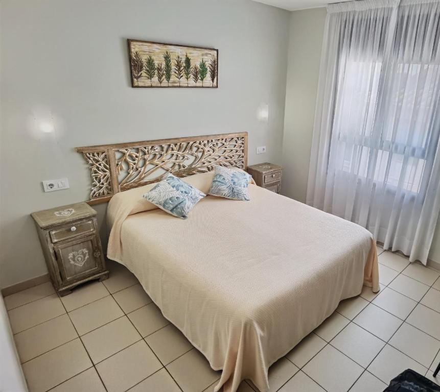 Postel nebo postele na pokoji v ubytování HOSTAL RIGAU