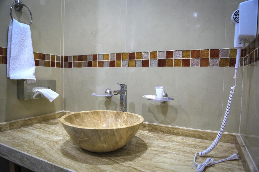 Koupelna v ubytování Hotel Alux