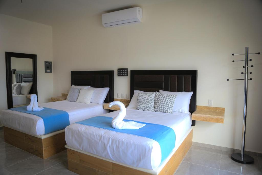 Postel nebo postele na pokoji v ubytování Hotel Alux