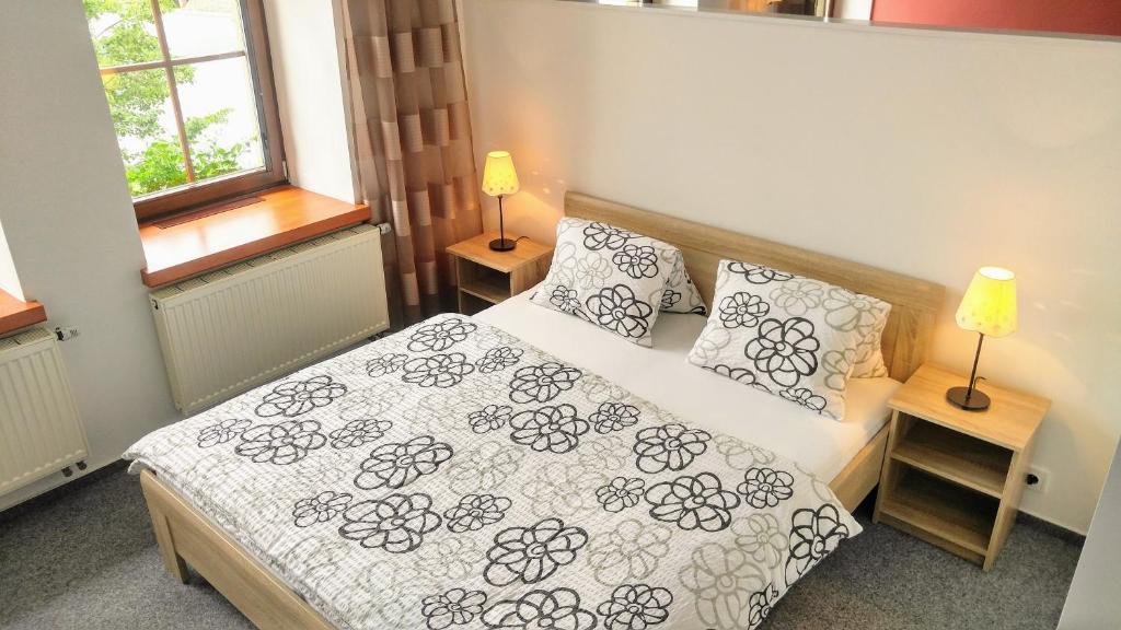 Postel nebo postele na pokoji v ubytování Apartmány Fišerovi