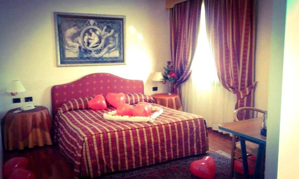 Posteľ alebo postele v izbe v ubytovaní Hotel Luna