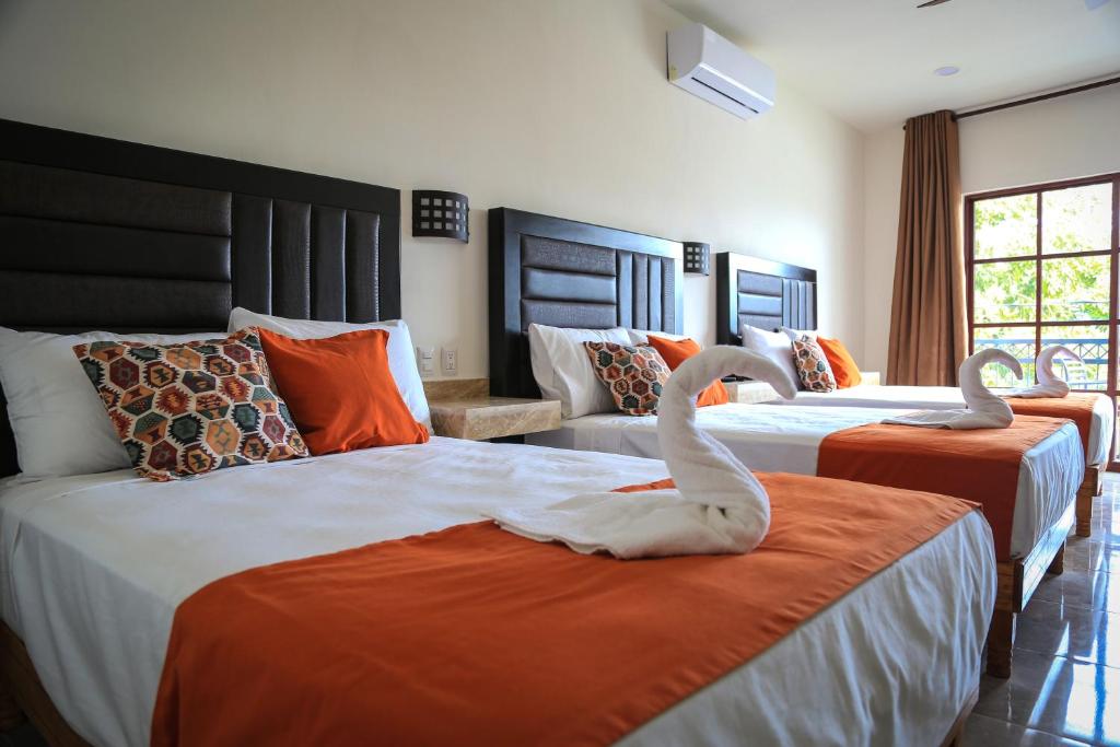 Postel nebo postele na pokoji v ubytování Hotel Alux