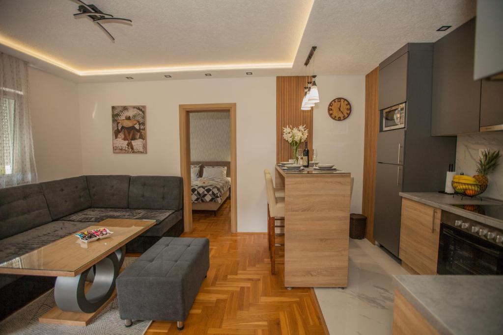 a living room with a couch and a table at Apartman Lena in Trebinje