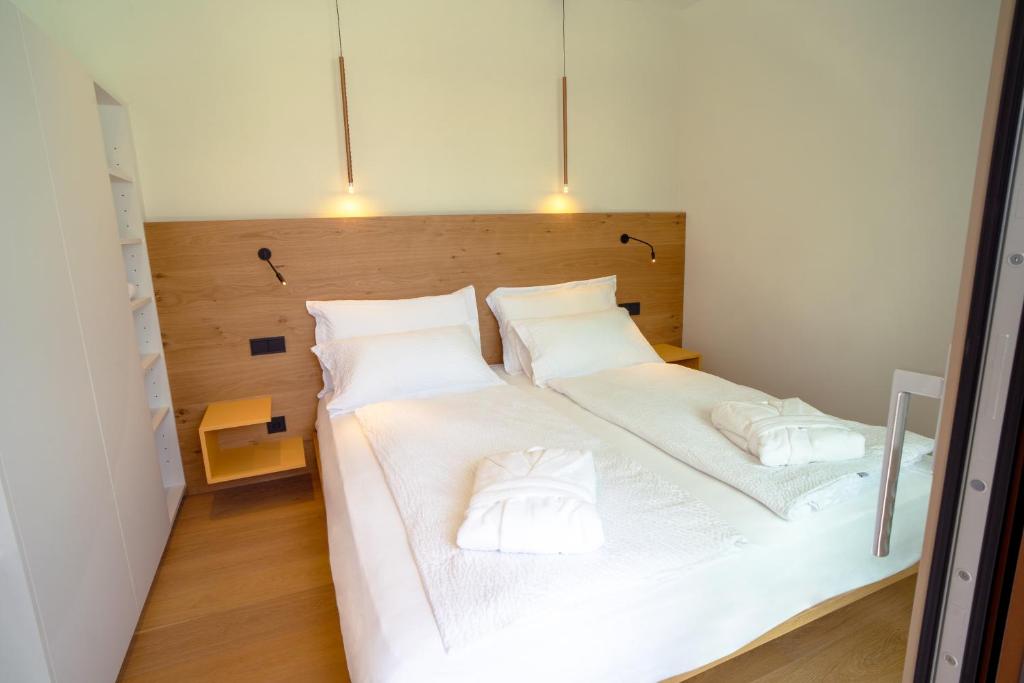 Postel nebo postele na pokoji v ubytování Wellness Smart Suites