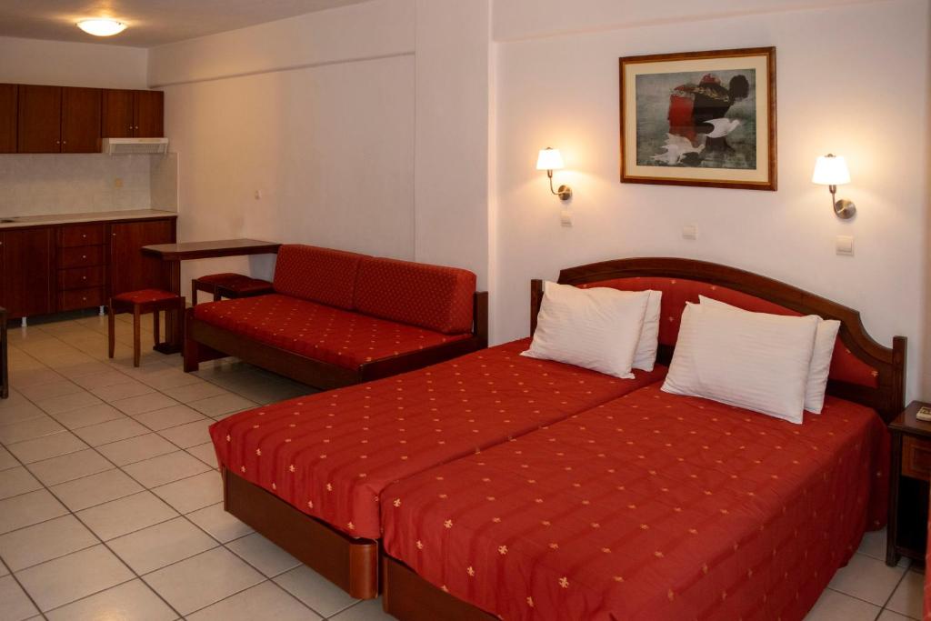 Postel nebo postele na pokoji v ubytování Giannoulaki Resort
