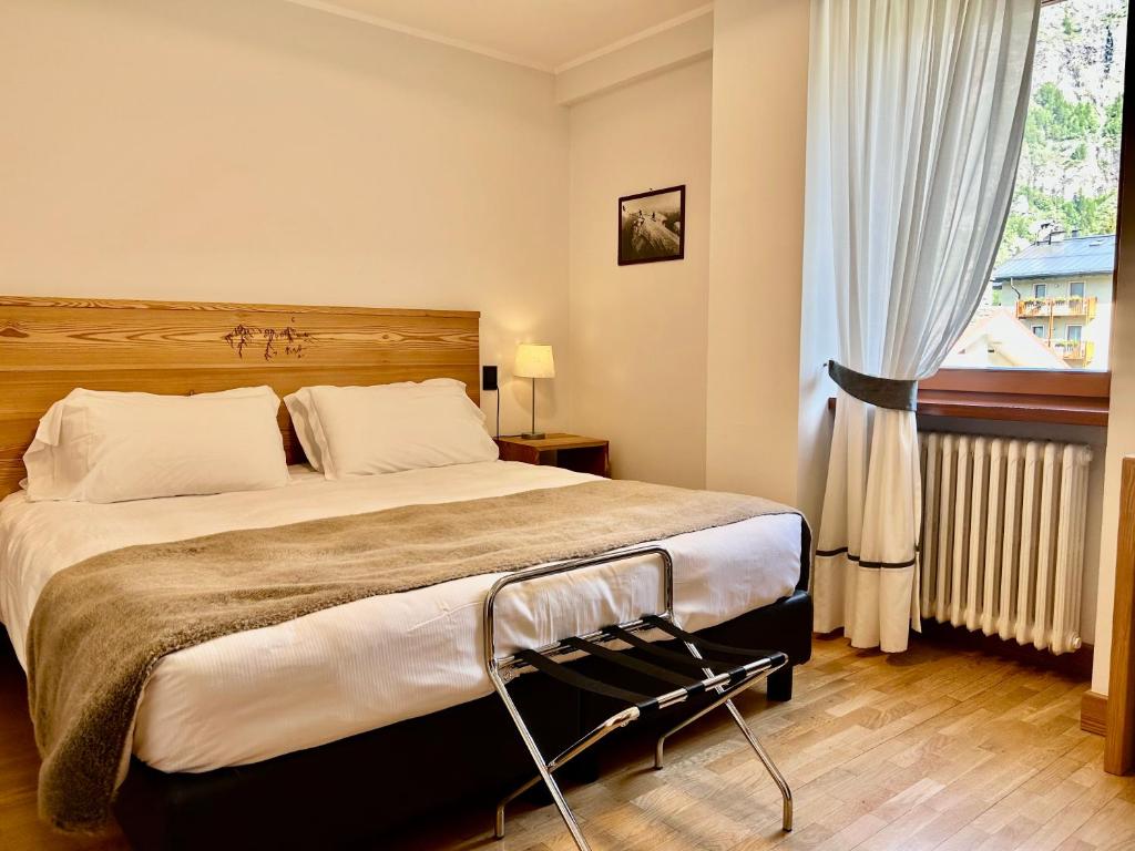Postel nebo postele na pokoji v ubytování Hotel Croux