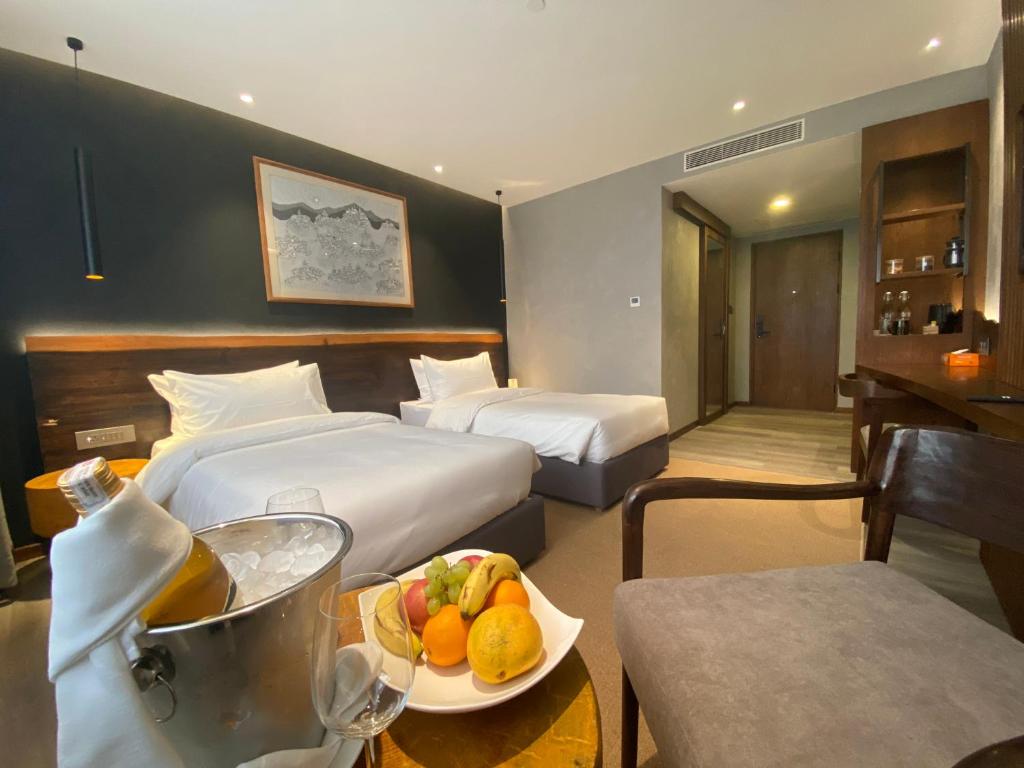 Postel nebo postele na pokoji v ubytování Hotel Barahi Kathmandu