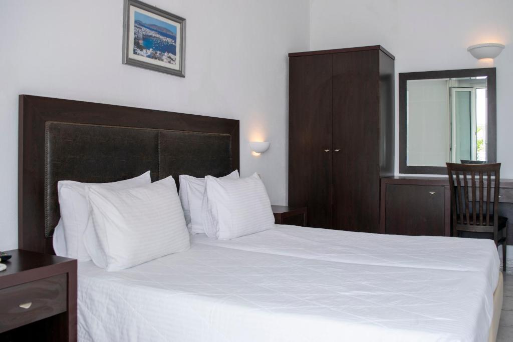 Postel nebo postele na pokoji v ubytování Giannoulaki Resort