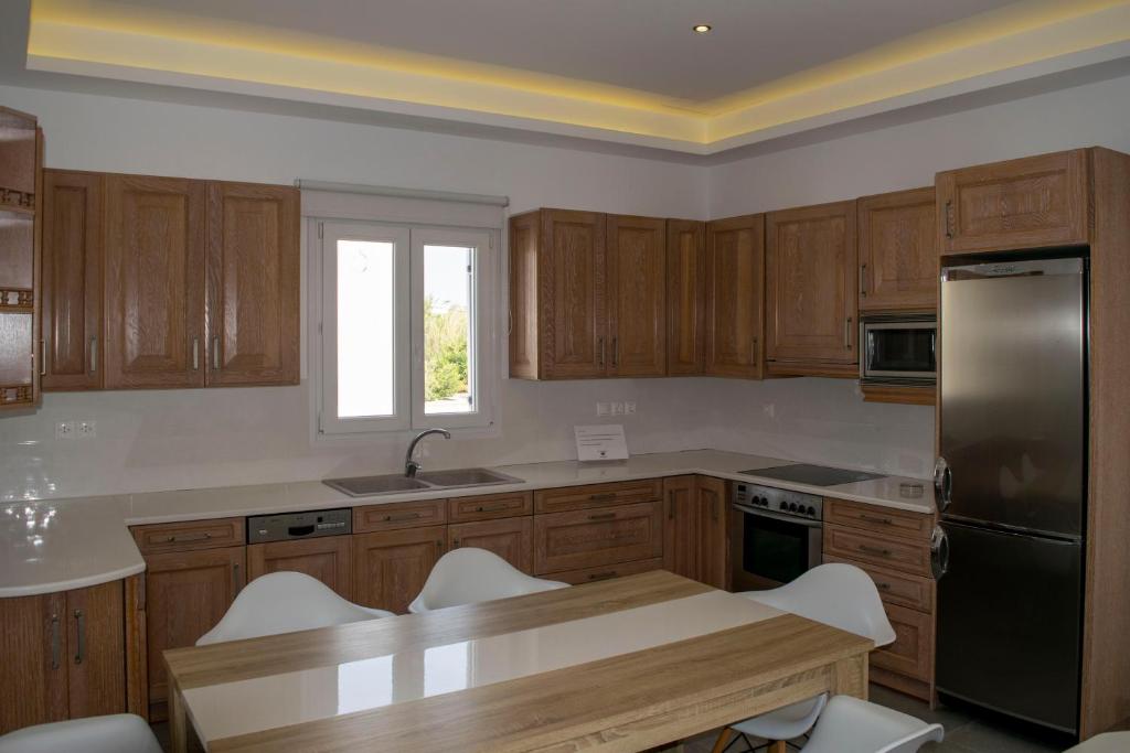 Kuchyň nebo kuchyňský kout v ubytování Giannoulaki Resort