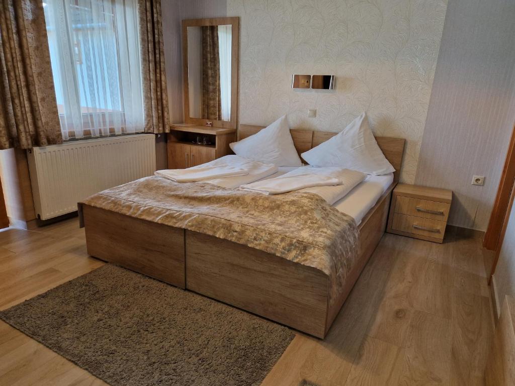 Postel nebo postele na pokoji v ubytování Csalánosi Vendégház