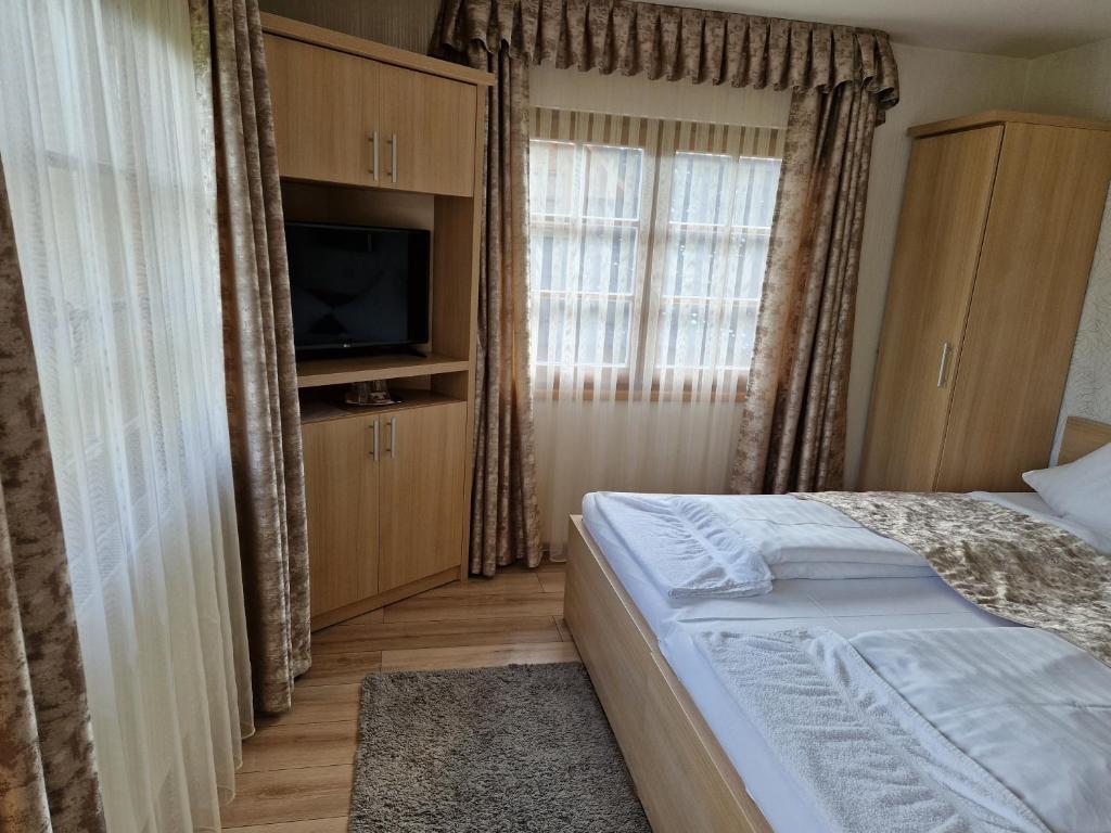 Postel nebo postele na pokoji v ubytování Csalánosi Vendégház