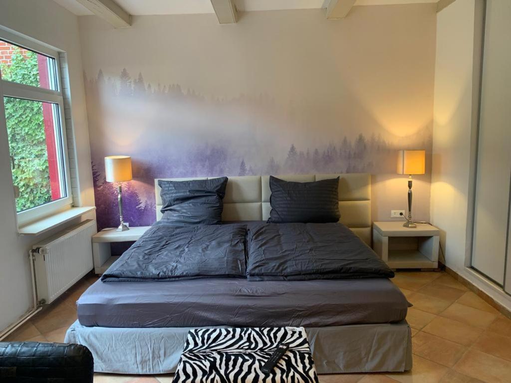 Postel nebo postele na pokoji v ubytování Kaptainshuus Apartment B