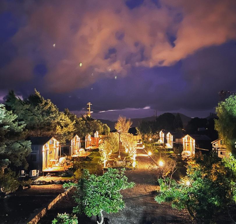 a row of houses lit up at night at Tiny Datca in Datca