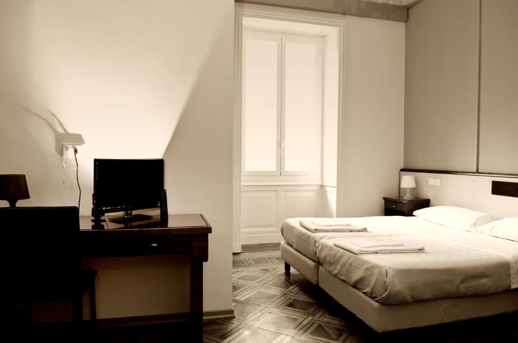 Posteľ alebo postele v izbe v ubytovaní Hotel Suisse