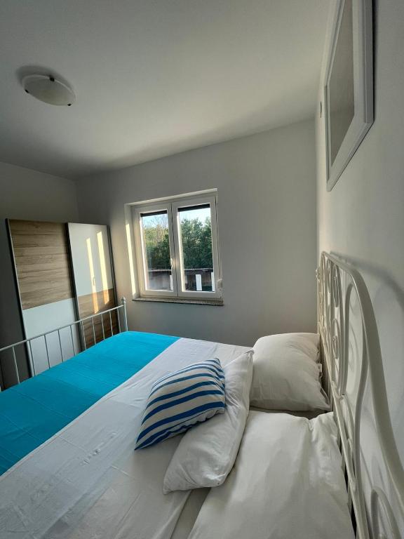 Postel nebo postele na pokoji v ubytování Apartman Kačić