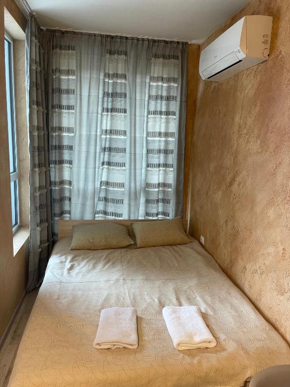 Postel nebo postele na pokoji v ubytování Colonel apartment 954