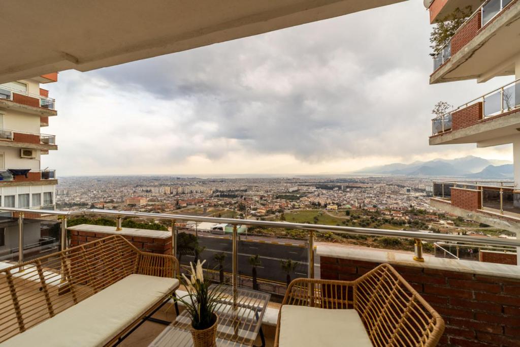 a balcony with a view of a city at Apartment with Panoramic City View in Kepez in Antalya