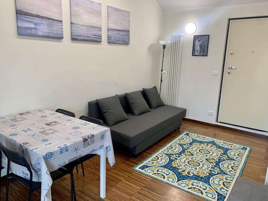 a living room with a couch and a table at Gassa d'Amante Appartamento in Rapallo