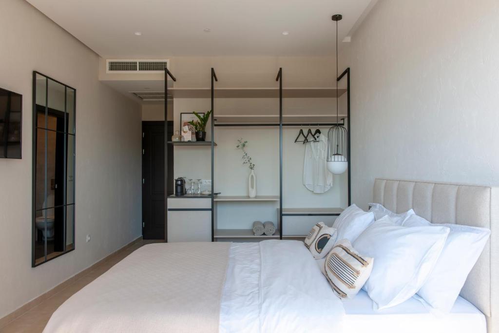 Postel nebo postele na pokoji v ubytování Soho Suites