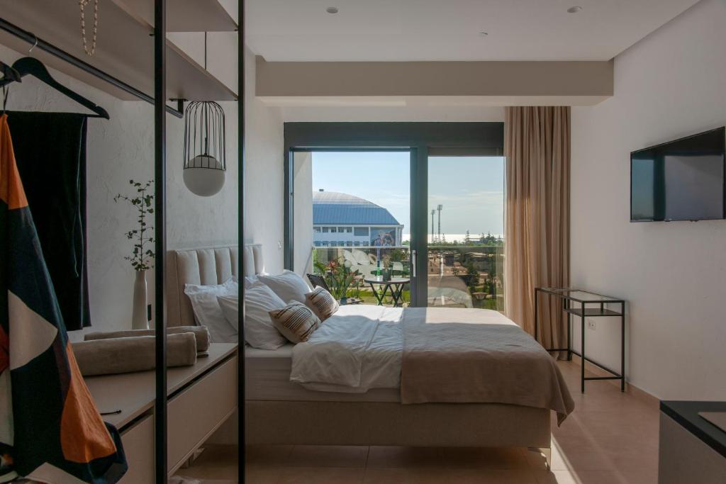 Postel nebo postele na pokoji v ubytování Soho Suites