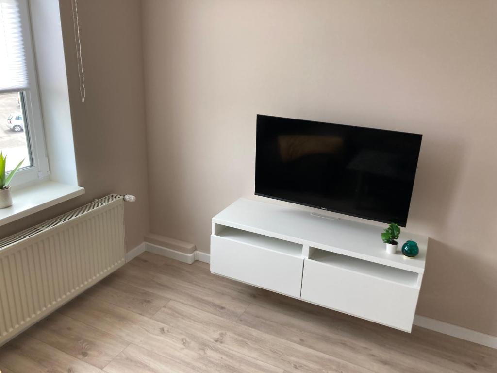 TV a/nebo společenská místnost v ubytování Helle Fewo Haus 29a, 2. Obergeschoss
