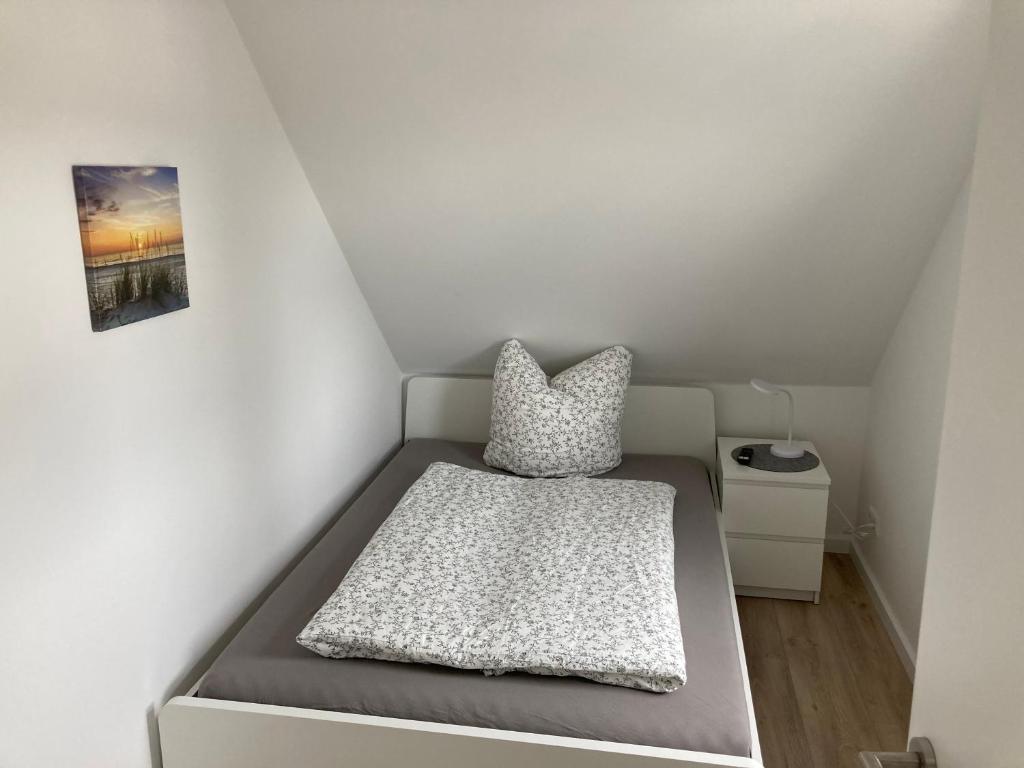 Postel nebo postele na pokoji v ubytování Helle Fewo Haus 29a, 2. Obergeschoss