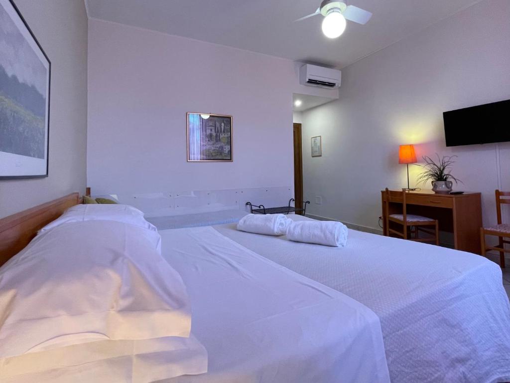 Postel nebo postele na pokoji v ubytování Hotel Leopolda