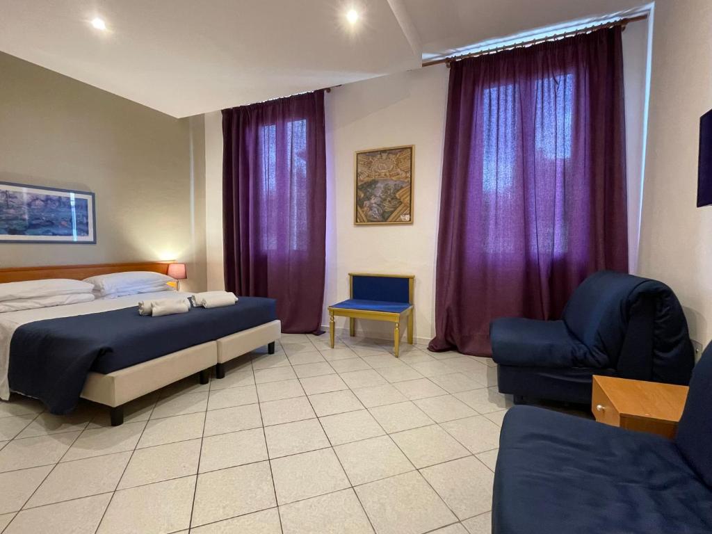 Postel nebo postele na pokoji v ubytování Hotel Leopolda