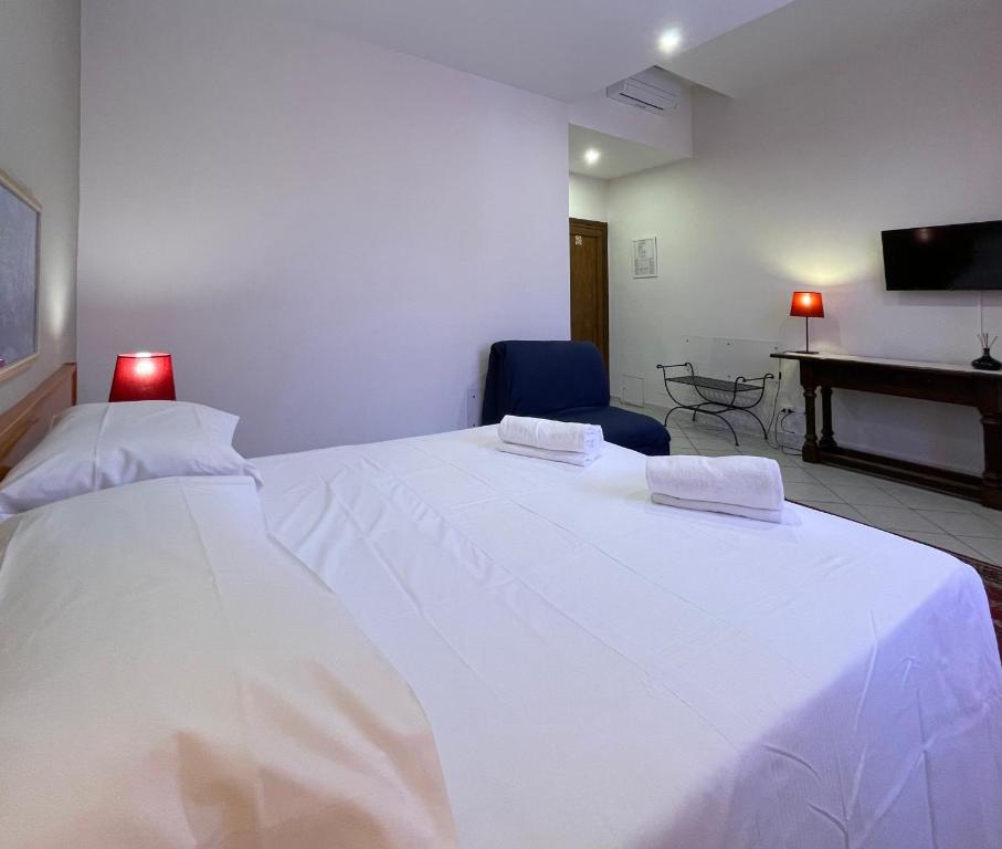 Postel nebo postele na pokoji v ubytování Hotel Leopolda
