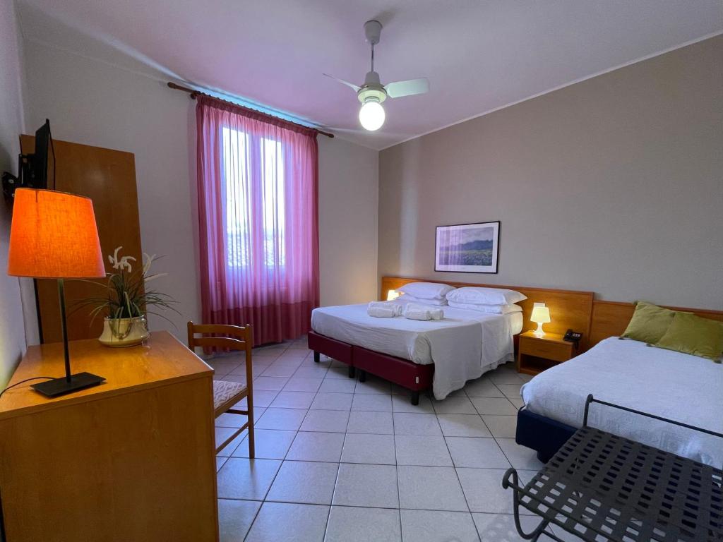 Postel nebo postele na pokoji v ubytování Hotel Leopolda