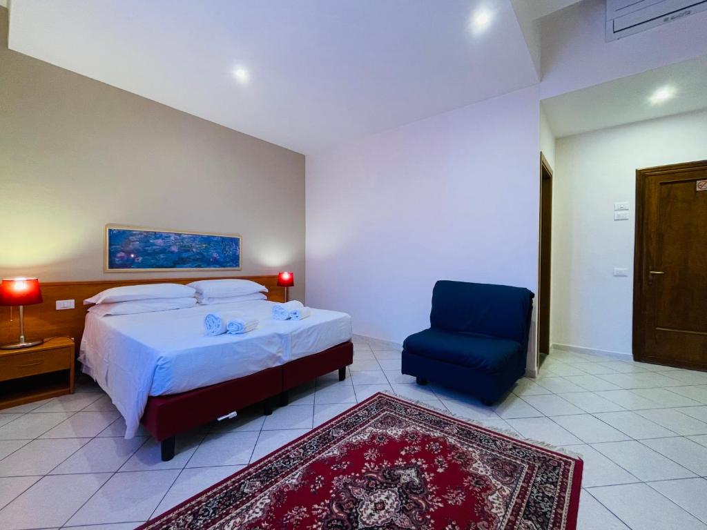 Postel nebo postele na pokoji v ubytování Hotel Leopolda