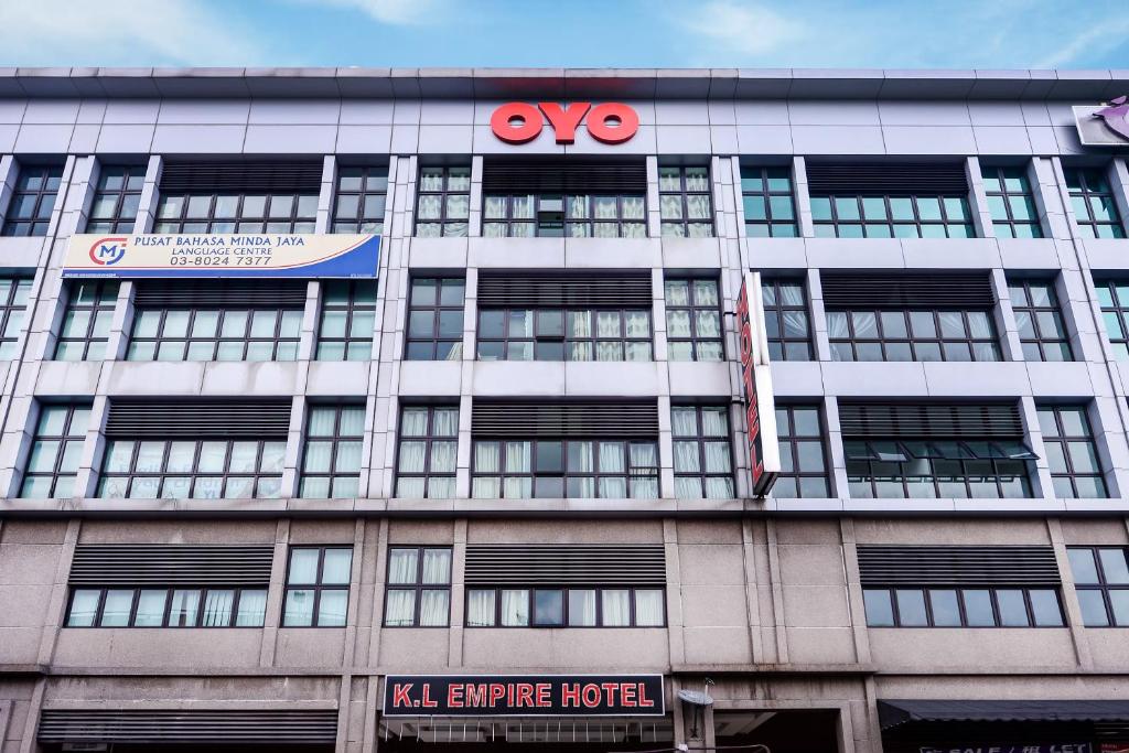 an office building with a kl earthquake hotel sign at OYO 444 KL Empire Hotel in Subang Jaya