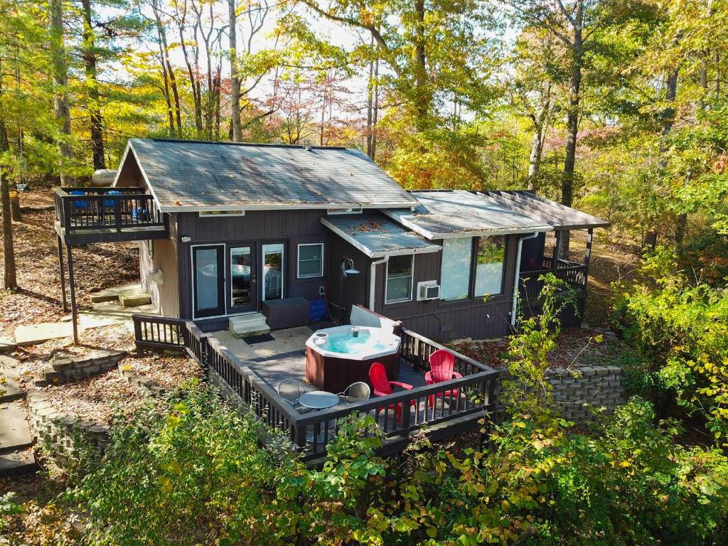 a small house with a hot tub in the yard at Lake House in Nashville