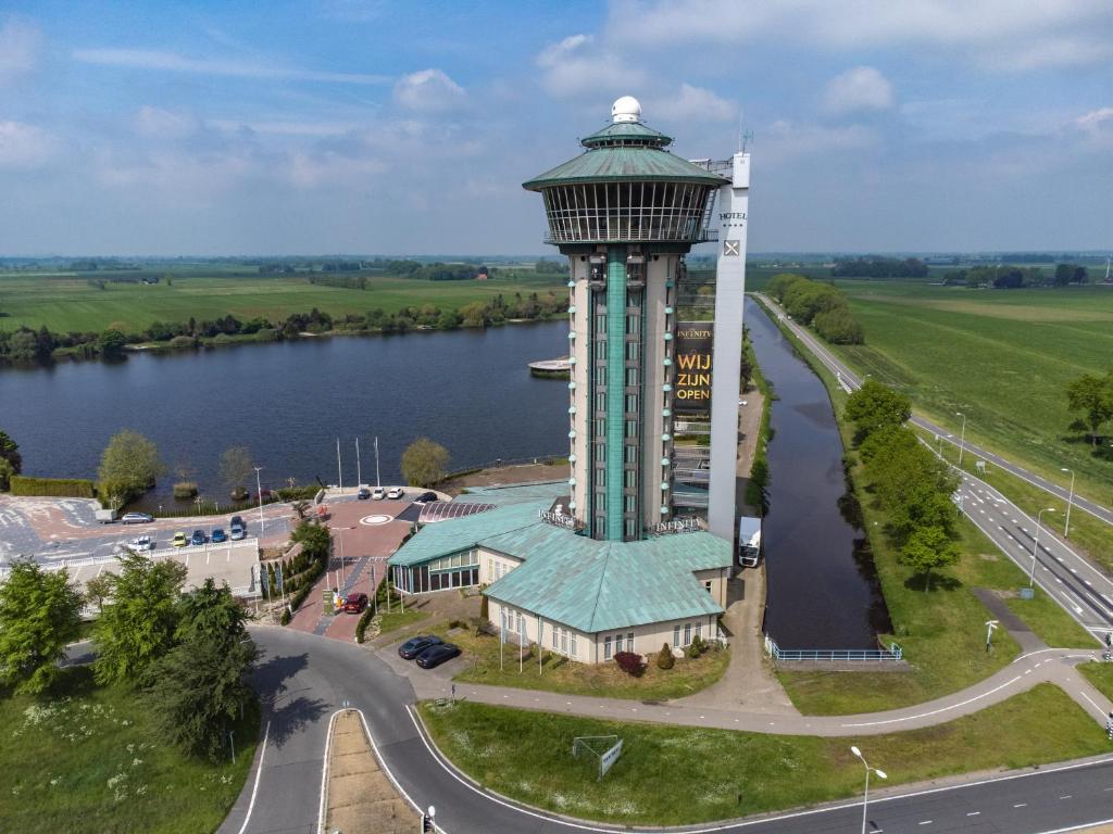 an aerial view of a control tower next to a river at Hotel & Restaurant Infinity in Lichtmis