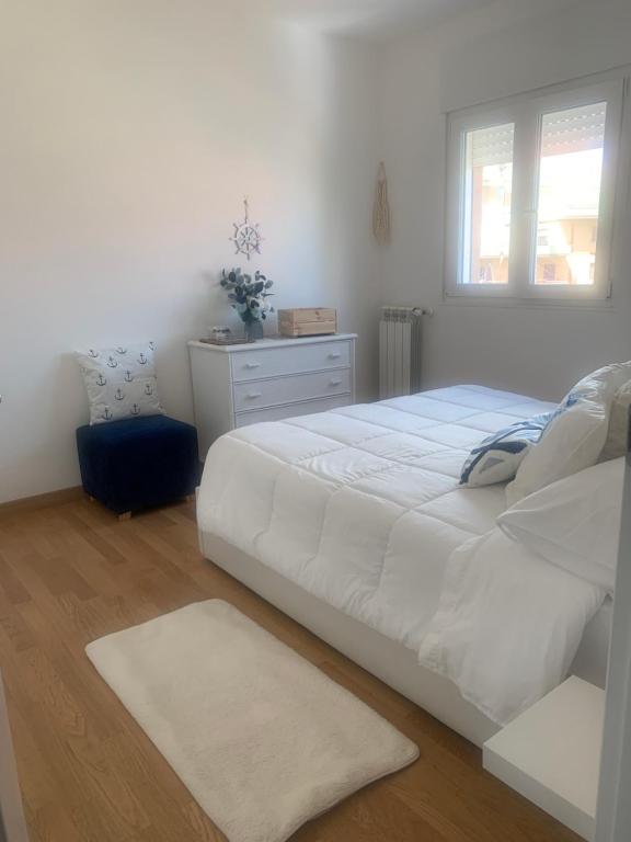 Posteľ alebo postele v izbe v ubytovaní Appartamento sul mare Nettuno