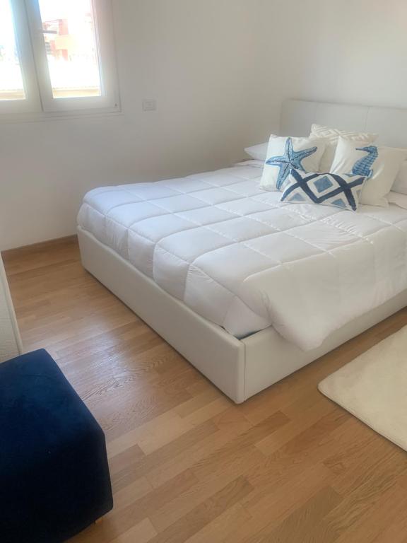 Posteľ alebo postele v izbe v ubytovaní Appartamento sul mare Nettuno